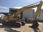 Side of used Komatsu Excavator in yard